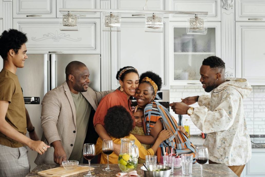 Multi-generational family gathered in a kitchen