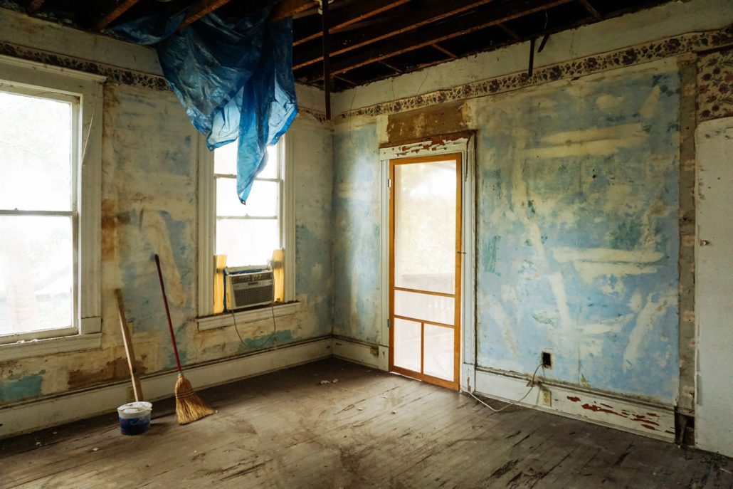 Home buying red flags - Inside of unfinished home with stripped walls